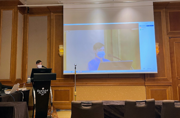 Max giving a presentation about the college application problem at a conference in Jeju